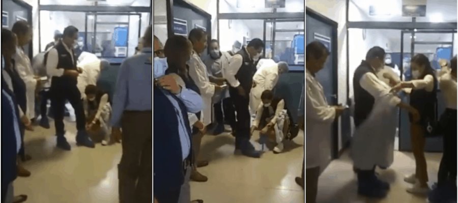 Critican a gobernador de Michoacán, por permitir que mujer se agachara para quitarle cubre zapatos Critican a gobernador de Michoacán, por permitir que mujer se agachara para quitarle cubre zapatos