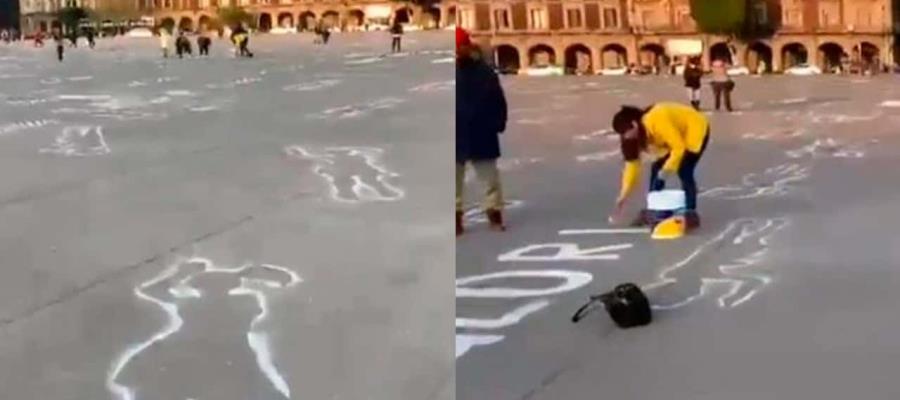 Pintan siluetas de mujeres en el Zócalo de la CDMX por el 25N