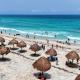 Se aleja "Beryl" y turistas vuelven a las playas de Quintana Roo