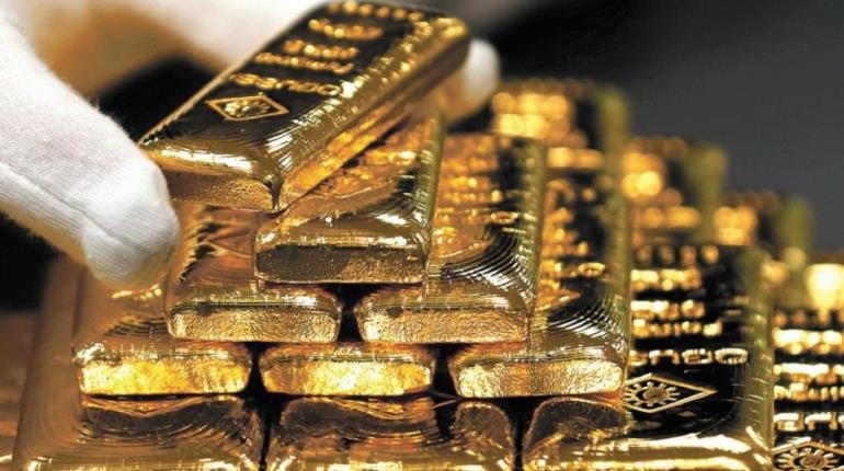 Precio del oro alcanza máximo histórico ante debilitamiento del dólar